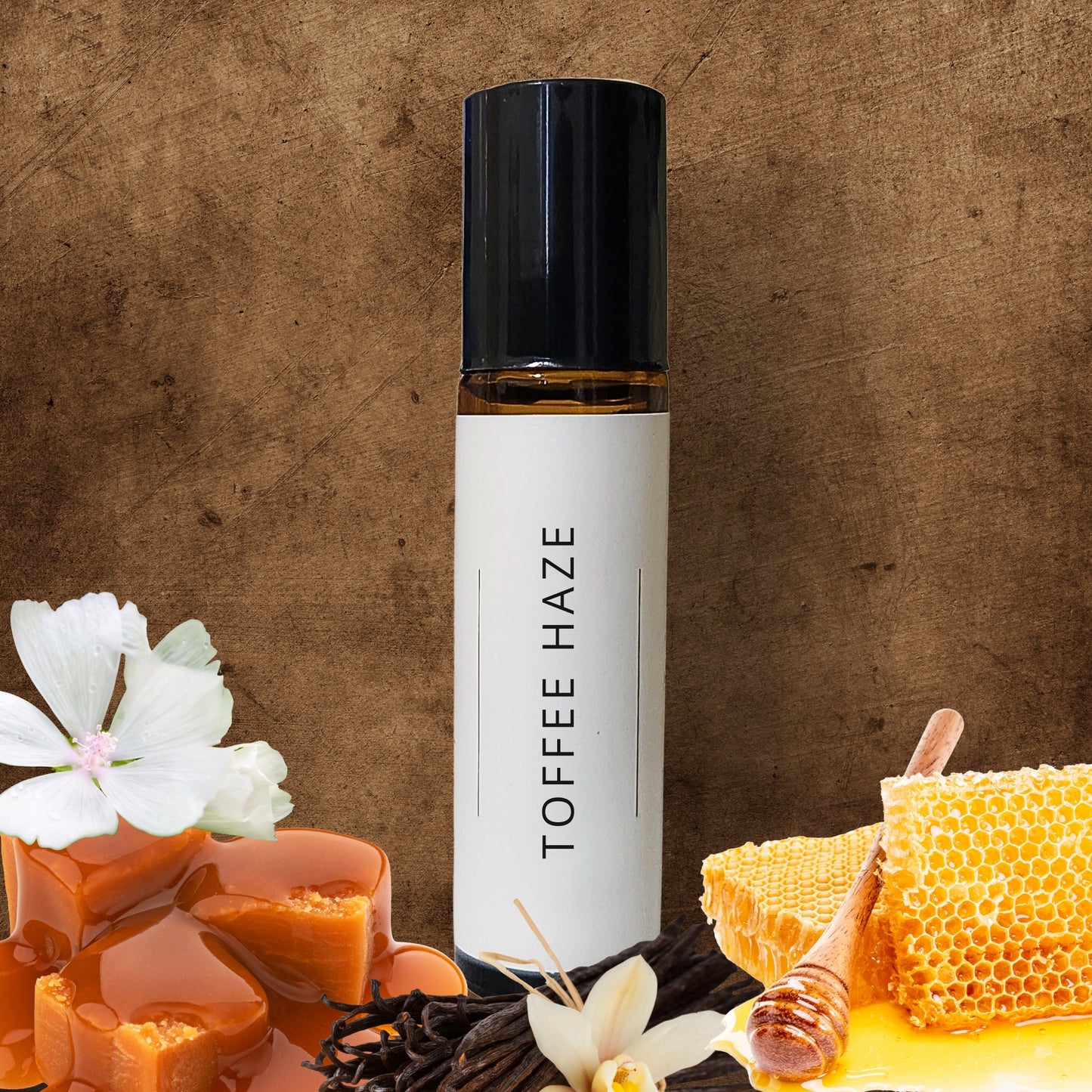 10ml Roll-on bottle labeled 'Toffee Haze' with toffee, honeycomb, and flowers on a brown background