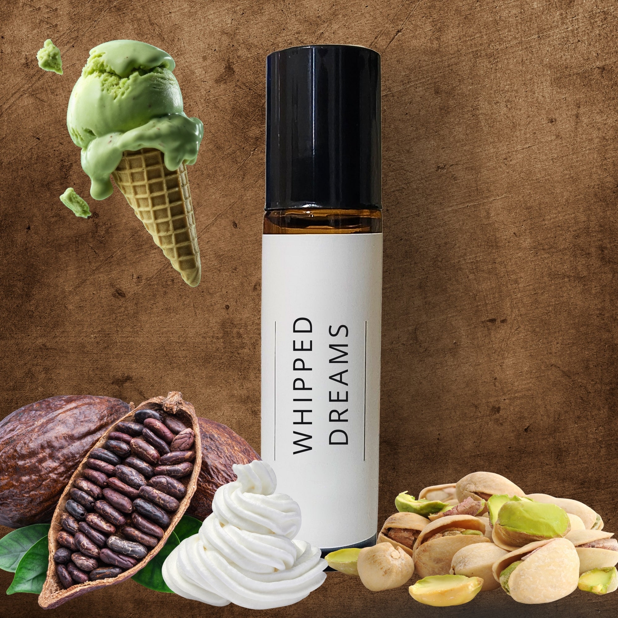 10ml Roller bottle labeled 'Whipped Dreams' surrounded by green ice cream, pistachios, and cacao beans on a brown background.